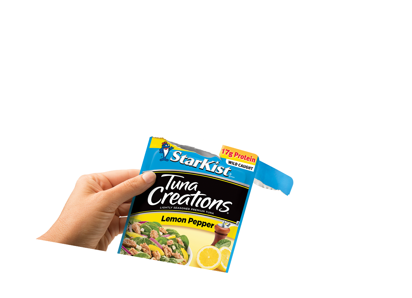 Hand holding a pouch of Starkist Tuna Creations
